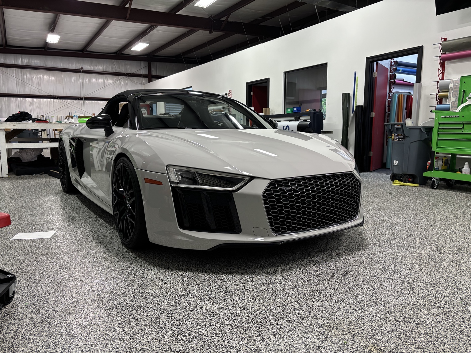 2018 Audi R8 wrapped in 3M 2080 Hi-Gloss Grey, front three-quarter view in the shop